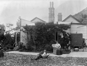 William Mathew Hodgkins and Frances Mary Hodgkins outside their house in Ravensbourne, Dunedin