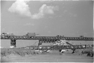A tank, and other military vehicles, crossing bridges over the Marecchia River, Italy, during World War 2