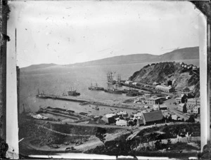 View looking down on Port Chalmers and the port, with the second Presbyterian Church centre right, and the graving dock at centre left.