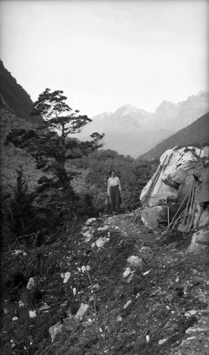 A woman standing on a track in the Eglinton River Valley, Southland