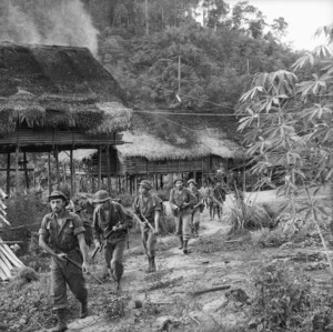 New Zealand soldiers leaving a Malayan village northwest of Ber base during the Malayan Emergency