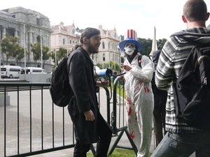 Photographs of an anti-war protest staged during Hillary Clinton's visit to Wellington