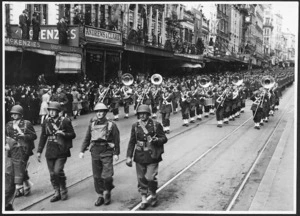 United States troops and brass band, marching down Queen Street, Auckland