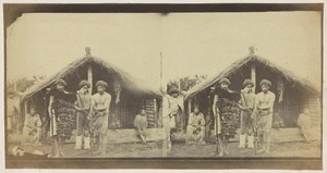 Maori group with muskets and an adze