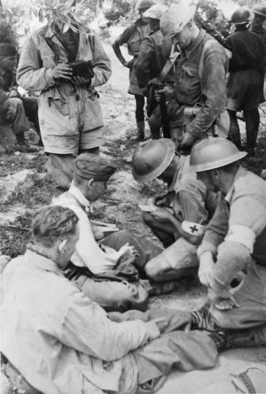 New Zealand ambulance men attending to German paratroopers