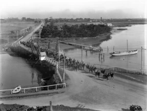 Mounted troops of the NZEF Canterbury Mounted Rifles crossing the Ferrymead Bridge over the Heathcote River, Christchurch