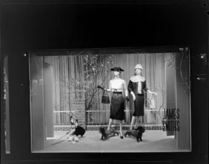 Dresses on display in window, James Smith Ltd., 1959