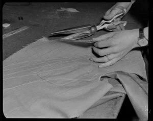 Fabric being cut in suit factory