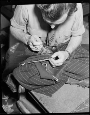 Man sewing in suit factory