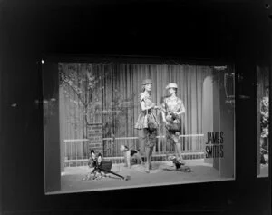 Dresses on display in window, James Smith Ltd., 1959