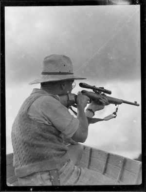 Man with rifle, Lake Rotoehu