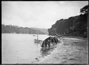 Boys with a dinghy at Little Shoal Bay, Auckland