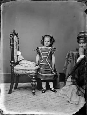 Unidentified girl with doll and [mother?]