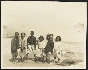 New Zealand Tourist and Publicity Department : Photograph of Maori children delivering a pukana while performing a haka