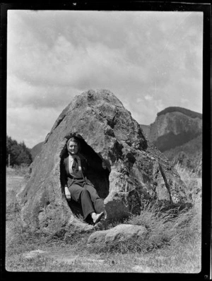 Zeila Wells sitting inside rock, Atiamuri