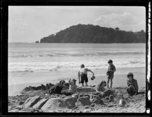 Armstrong children making sandcastles at Woolley's Bay