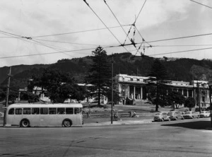 View of Parliament Buildings, and a trolley bus, Molesworth Street, Wellington