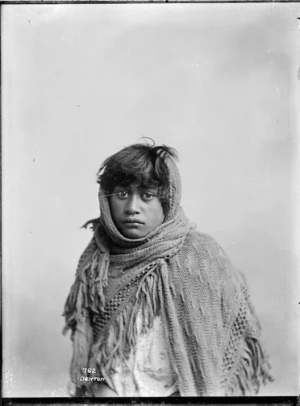 Young Maori girl wrapped in a shawl - Photograph taken by Frank J Denton