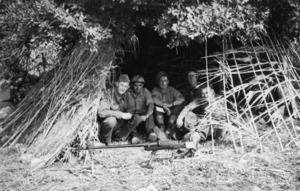 Troops behind bamboo and oats which were used for protection, on Crete