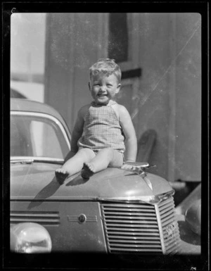 Kevin sitting on car bonnet at Woolley's Bay
