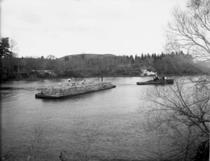 Sacks of pumice being transported by barge, Whanganui River