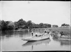 Boys playing on a boat at Deep Creek, Torbay, Auckland