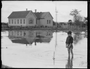 Robert Wells and toy boat in flood