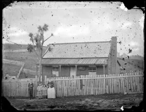 Unidentified house, Wanganui, with woman and children outside