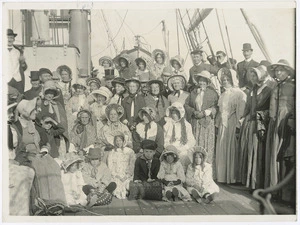 Creator unknown : Photograph of a group in costume, reconstructing a scene showing settlers landing at Petone