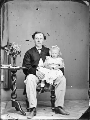 Unidentified man with little girl