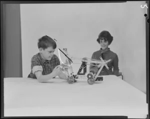 Kenyon Brand and Riggs, Boy with Toy and Shopping Reporter