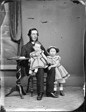 Reverend Basil Taylor with two daughters