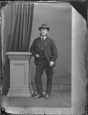 Unidentified man with hat and cane