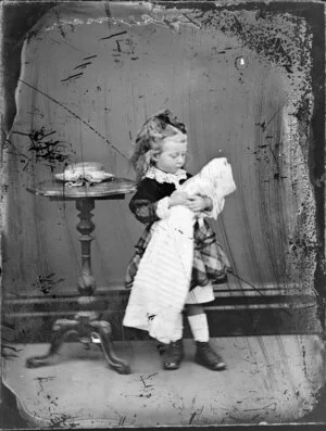 Unidentified girl with a doll