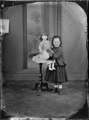 Unidentified girl holding a doll