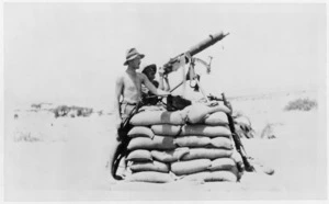 World War I soldiers manning an anti-aircraft gun in the desert