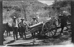 World War I soldiers by a field gun
