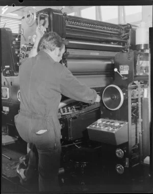 Man operating print press