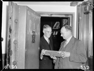 Mr M A Castle and Mr Jenkinson examine a canister found at Wellington South School