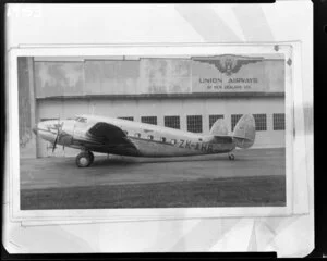 Plane with Union Airways of New Zealand building in background