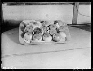 Rotten apples on a tray