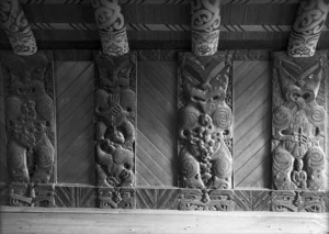 Carved wooden panels and kowhaiwhai inside Te Mana-o-Turanga meeting house in Manutuke