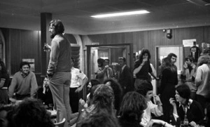 Kiwi pub chap standing on chair