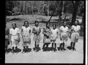 Pupils from Ngatangiia School, Rarotonga, Cook Islands, with baskets they had made - Photograph taken by W Walker