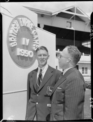 South African sprinter Howard Kinsman with Mr L A Tracy, 1950 British Empire Games, Eden Park, Auckland