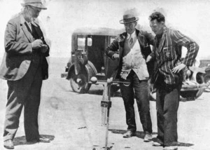 Dr Charles Edward Adams reading an anemometer during Norman Smith's attempt on the land speed record