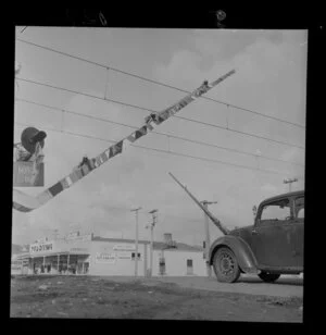 New automatic railway crossing arms being raised or lowered, [Hutt Valley]