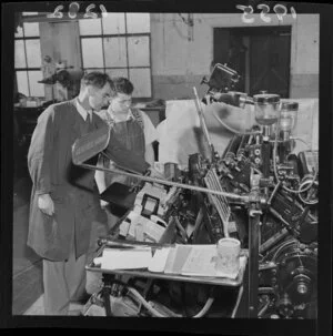 Two men using a printing press, Evening Post, Wellington