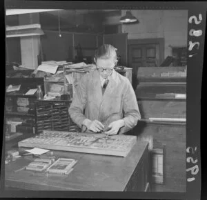 A man sorting the metal typeset for the Evening Post printing press, Wellington