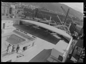 Ocean liner SS Southern Cross, docked at King's Wharf, Wellington, including a view of Wellington Railway Station